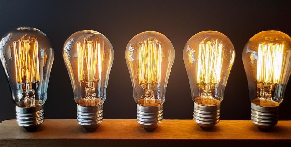 Light Bulbs in a Row Getting Brighter From Left to Right
