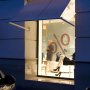 KLUS PAC-ALU corner mount profile fixture installed in a retail storefront window display