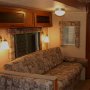 LED Vintage Light Bulb - ST18 LED Bulb w/ Filament LED - 5W: Shown Installed In Overhead Ceiling Fixture And Wall Sconce In Warm White. 