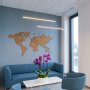 GIZA-LL aluminum channel fixtures suspension mounted over purple orchids in a lobby