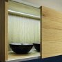 Silver anodized TAPO aluminum channel fixture installed as interior cabinet lighting