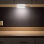 Included mounting clip has adhesive backing for mounting light to flat surfaces such as under cabinets or utility closet walls.