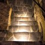 LED Hardscape Lighting - 8&amp;quot;  Deck / Step and Retaining Wall Lights w/ Mounting Plates: Showing 12&#039; Version Installed In Custom Staircase In Warm White. 