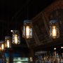 LED Vintage Light Bulb - Radio Style T10 LED Bulb w/ Filament LED - Dimmable: Shown In Pendant Style Fixtures Over Bar In Ultra Warm White. 