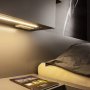 MICRO-NK silver anodized aluminum LED strip channel installed as reading light above a bedside table