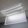 30W LED magnetic strip troffer retrofit kit installed and on in an open 2x4 troffer