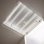 40W LED magnetic strip troffer retrofit kit installed and illuminated in an open 2x2 troffer