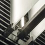A KLUS REGULOR aluminum channel fixture illuminating frosted glass panels