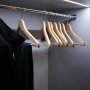 TAMI aluminum channel fixture with a frosted lens flush mounted in a wardrobe