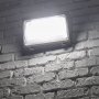 Architectural wall pack has a borosilicate glass lens for non-yellowing. Light is distributed in a wide 90° x 100° beam pattern.