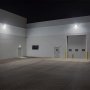 Line the exterior of a commercial or industrial space with multiple wall packs to fully illuminate and secure the perimeter.