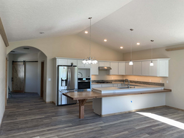 Kitchen with downlights and hanging ceiling lights